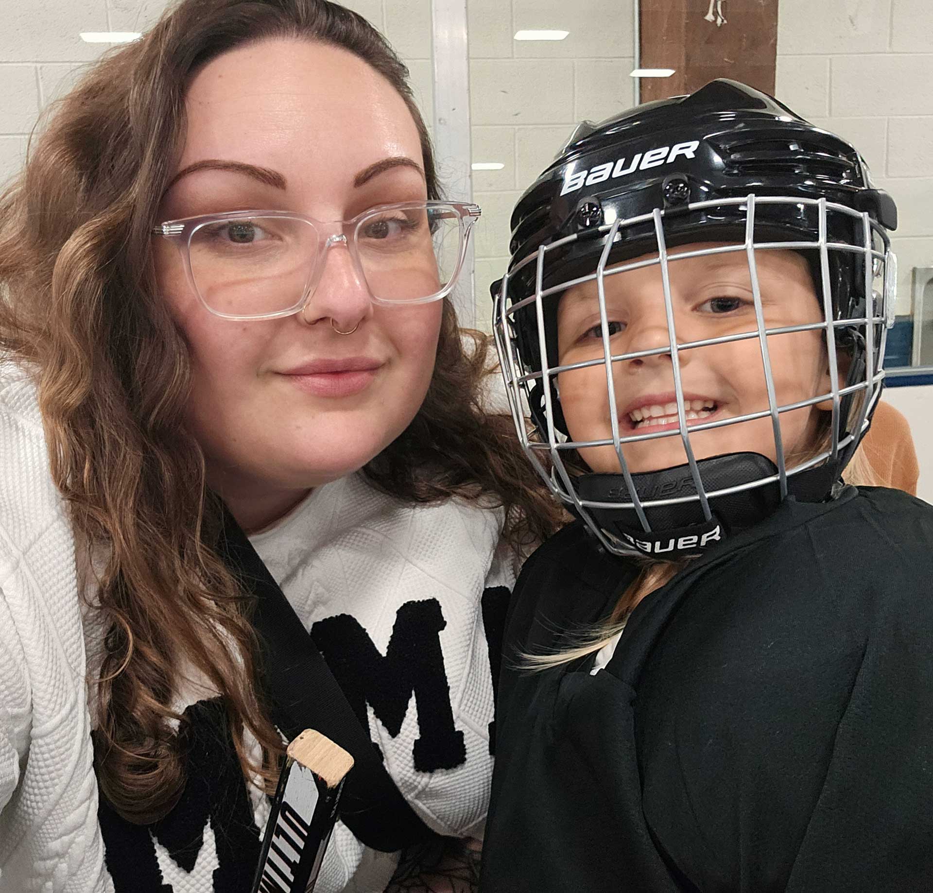 Kayla Clementi and her daughter, all geared up for hockey